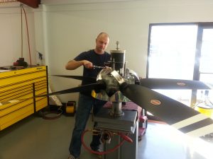Technician working on Hartzell propeller in prop shop at Intercontinental Jet Service Corps