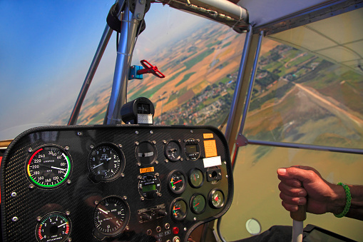 Pilot hand inside the cockpit of a Ninja plane