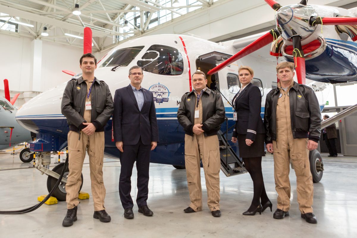 Pilots in front of an aircraft for Latin America demo tour