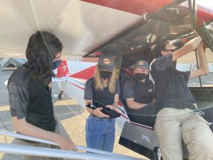 Group of students working on airplane