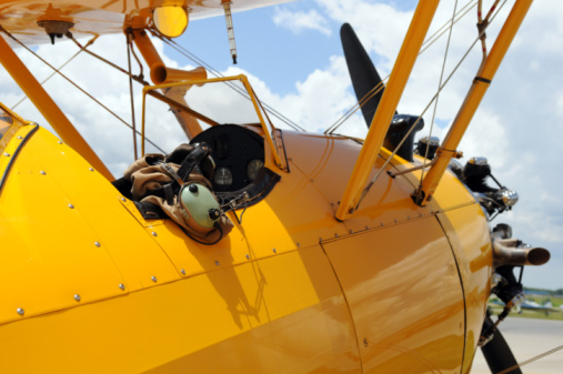 Yellow PT-17 aircraft on a runway
