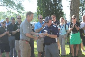 Joe Brown of Hartzell Propeller receiving a plaque from Piper Aircraft